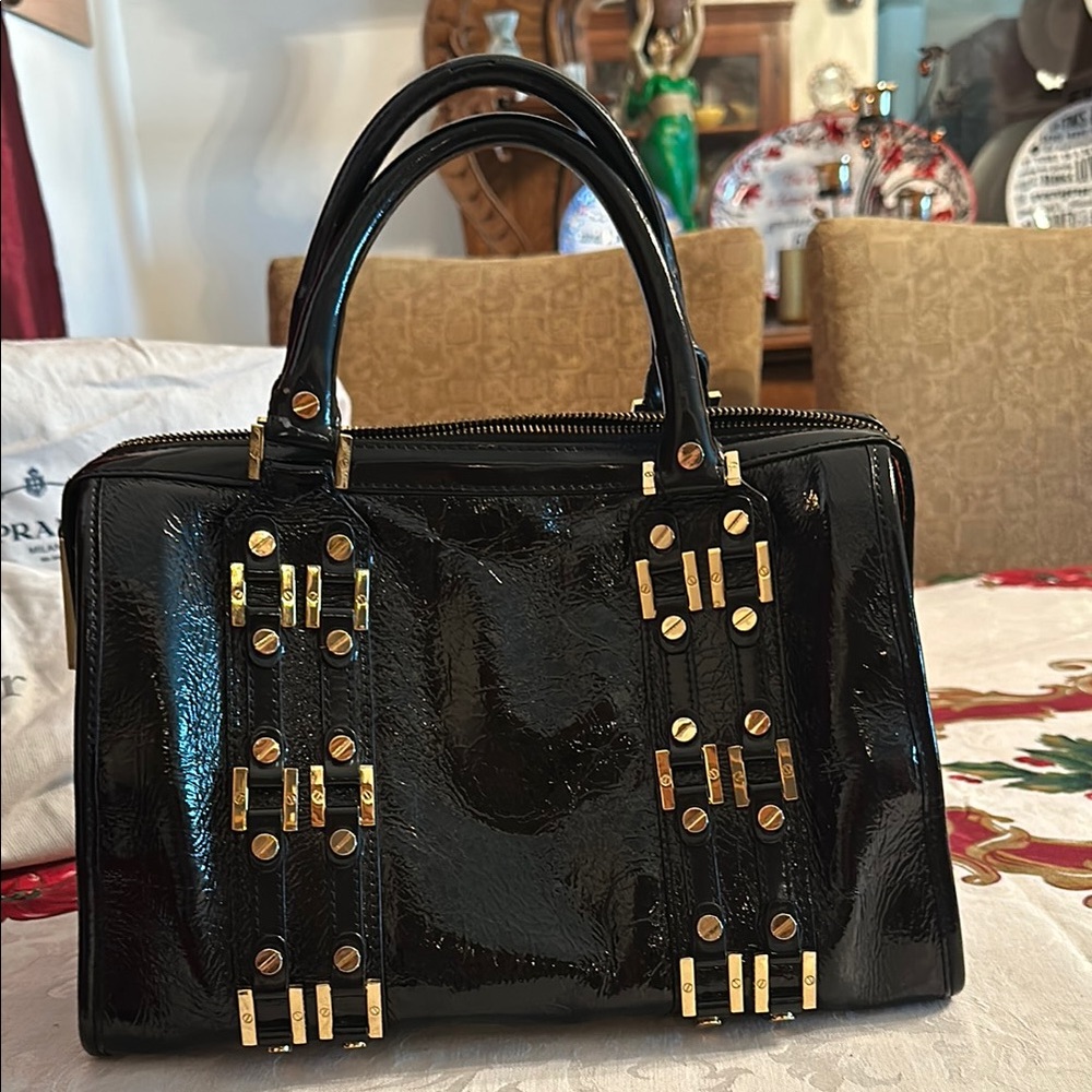 Black Patent Leather Handbag with Gold Accents